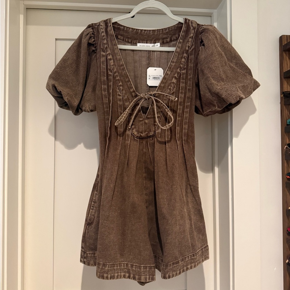 Altar’d State Puff-Sleeve Denim V-Neck Romper with Front Tie in Brown